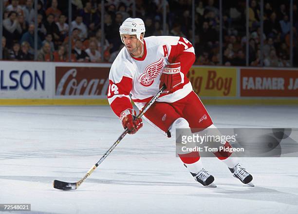 Forward Brendan Shanahan of the Detroit Red Wings skates with the puck during the NHL game against the Ottawa Senators at Joe Louis Arena in Detroit,...