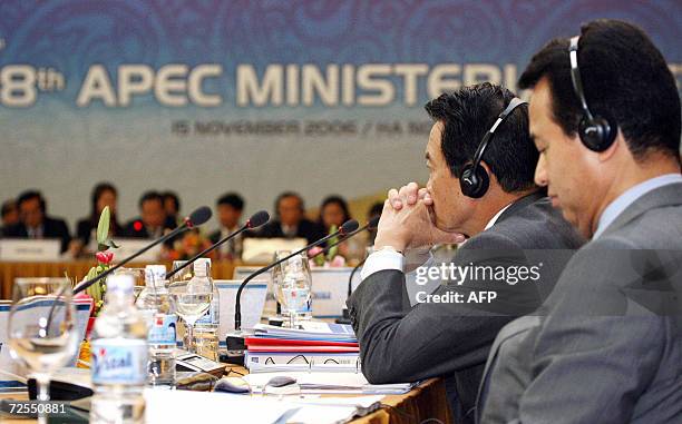 Japanese Foreign Minister Taro Aso and Economy, Trade and Industry Minister Akira Amari attend the Asia Pacific Economic Cooperation Ministerial...