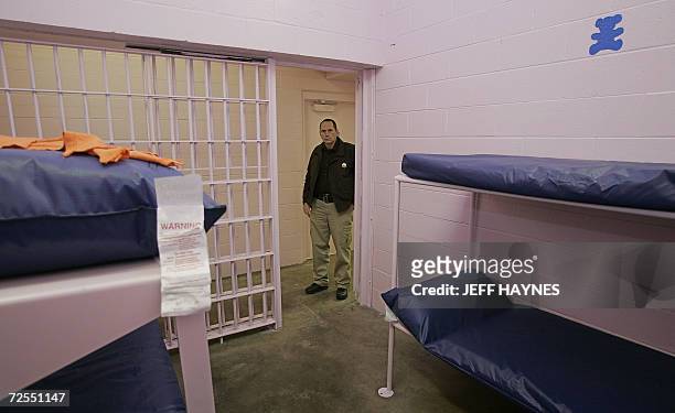 Buffalo, UNITED STATES: Dallas County Sheriff Mike Rackley stands in the hallway 14 November 2006 of his newly painted county jail with the color...