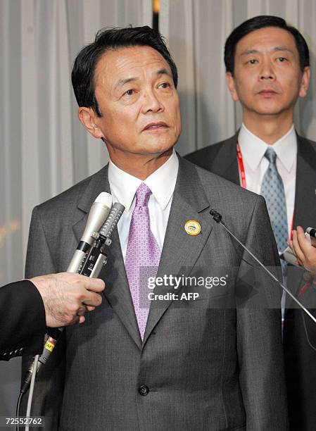 Japanese Foreign Minister Taro Aso answers a question during his news conference at a hotel in Hanoi, 15 November 2006. Foreign ministers from...