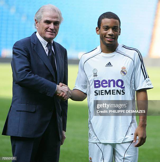 Real Madrid's new signing 18-year-old Marcelo Vieira Da Silva Junior, known simply as Marcelo shakes hands with Real President Ramon Calderon during...