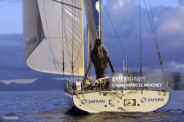 Pointe-a-Pitre, FRANCE : French sailor Marc Guillemot skips his Imoca class monohull "Safran", 15 November 2006, as he arrives 7th at Pointe-a-Pitre,...
