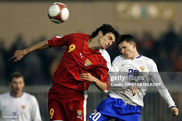 Macedonia's forward Goran Maznov and Russia's midfielder Igor Semshov jump for the ball during their EURO 2008 qualifying match in Skopje, 15...