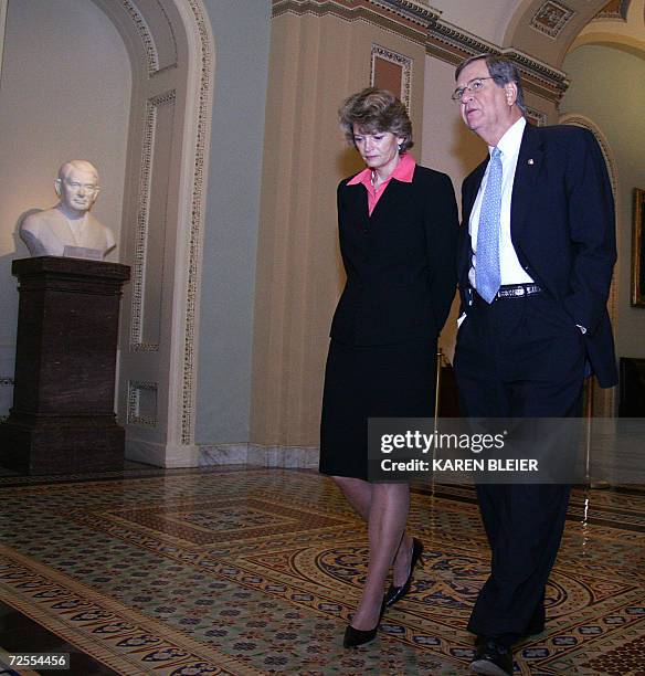 Washington, UNITED STATES: US Senator Trent Lott , R-MS, chats with Sen. Lisa Murkowski, R-AK, as they walk to the old Senate chamber to vote for the...