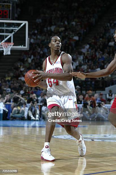 Chris Wilcox of Maryland moves against the defense of North Carolina State during the ACC Tournament game at the Charlotte Coliseum in Charlotte,...