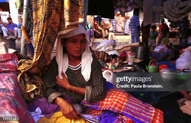 Refugees crowd together at a Acehnese refugee camp December 1999 in Indonesia's northernmost province of Aceh on the island of Sumatra. Violence in...