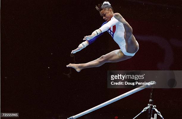 Dominique Dawes flys over the bar during her routine at the Georgia Dome in the 1996 Olympic Games in Atlanta, Georgia. Mandatory Credit: Doug...