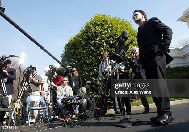 Bono , lead singer of Irish pop group U2, speaks to the news media March 14, 2002 at the White House in Washington, DC. Bono returned to the White...