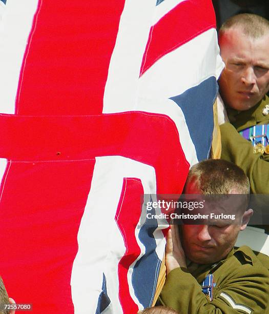 Soldiers of The Royal Highland Fusiliers carry the coffin of Fusilier Gordon Gentle during his funeral at St James' Parish Church on July 7, in...