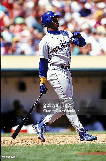Ken Griffey Jr.#24 of the Seattle Mariners hits the ball during a game against the Oakland Athletics. Mandatory Credit: Otto Greule Jr. /Allsport