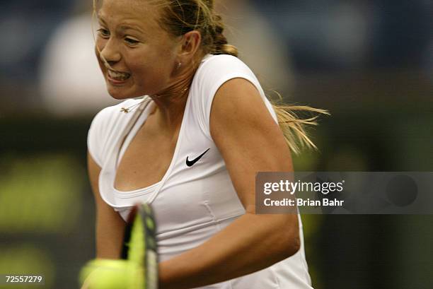 Fourteen-year-old Maria Sharapova of Russia returns a volley against Monica Seles of the USA during the Pacific Life Open at the Indian Wells Tennis...