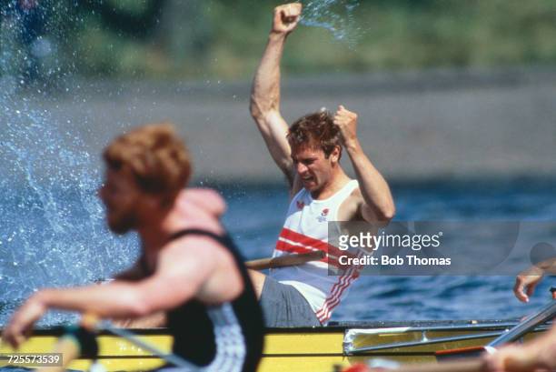 English rower Steve Redgrave raises his arms in the air in celebration after finishing in first place to win the gold medal in the Men's single...