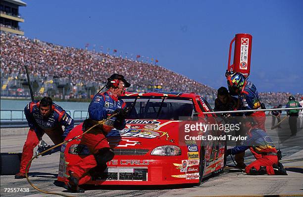 Jeff Gordon makes a pit stop during the Pennzoil 400, part of the NASCAR Winston Cup Series at the Homestead - Miami Speedway in Homestead, Florida....