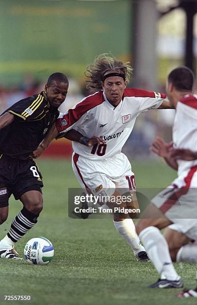 Edwin Gorter of the New England Revolution tries to steel the ball from Andy Williams of the Columbus Crew during the game at the Columbus Crew...