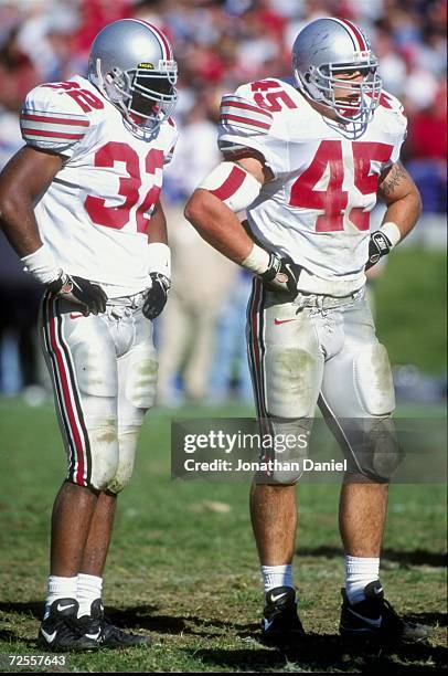 Linebackers Andy Katzenmoyer and Na''il Diggs of the Ohio State Buckeyes look on during the game against the Northwestern Wildcats at Ryan Field in...