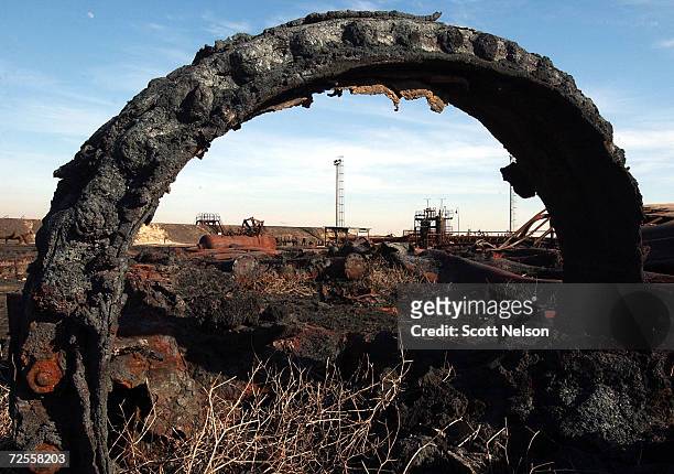An oil collection facility lies in ruins at the giant Burgan oil field January 13, 2003 in Central Kuwait. The oil field, the largest in the world,...