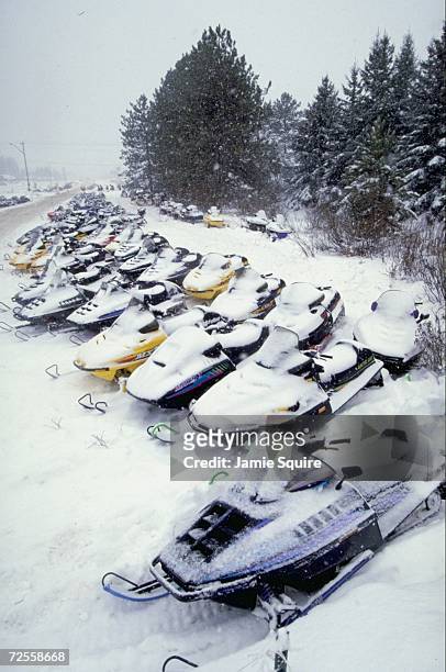 View of snowmobiles covered in snow during the World Championship Snowmobile Derby in Eagle River, Wisconsin. Mandatory Credit: Jamie Squire /Allsport