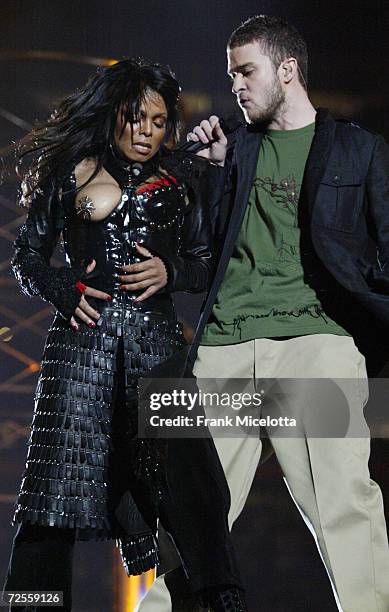 Singers Janet Jackson and surprise guest Justin Timberlake perform during the halftime show at Super Bowl XXXVIII between the New England Patriots...