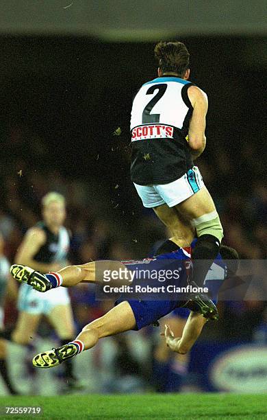 Darryl Wakelin#2 of Port Adelaide takes a mark over Simon Garlik of the Western Bulldogs, during the round 21 AFL match played between the Western...