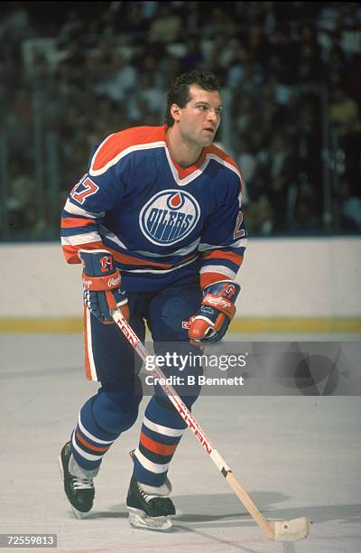 Canadian professional ice hockey player Dave Semenko of the Edmonton Oilers, skates on the ice during a road game, 1980s. Semenko played for the...