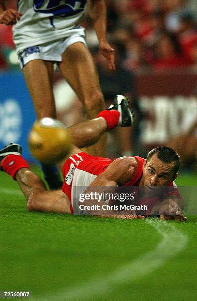 Paul Kelly of the Swans loses control of the ball during the round 4 AFL match between the Sydney Swans and the Kangaroos held at the Sydney Cricket...