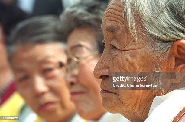 Moon Pil-Ki , a former World War II South Korean comfort woman, attends a protest in front of the Japanese Embassy March 13, 2002 during the 500th...