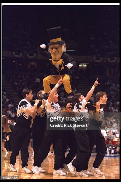 The Wake Forest Demon Deacons cheerleader and mascot march onto the court during the eastern regional semi-final NCAA match up against the Oklahoma...