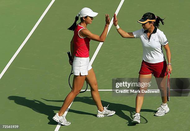 Zi Yan and Jie Zheng of China celebrate their win over Casey Dellacqua and Nicole Sewell of Australia during day four of the Moorilla International...