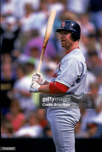 Mark McGwire of the St. Louis Cardinals stands at the plate during the game against the Colorado Rockies at Coors Field in Denver, Colorado. The...