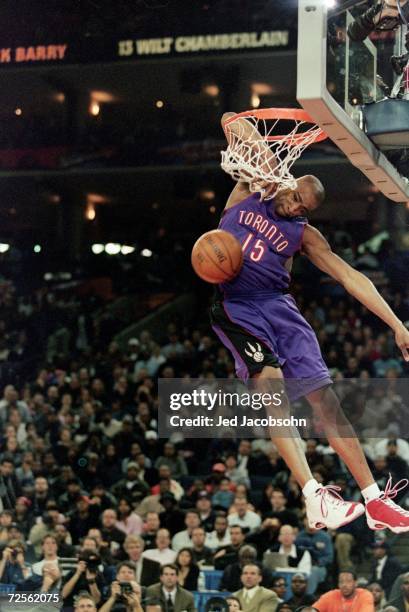Vince Carter of the Toronto Raptors jumps to make the slam dunk during the NBA Allstar Game Slam Dunk Contest at the Oakland Coliseum in Oakland,...