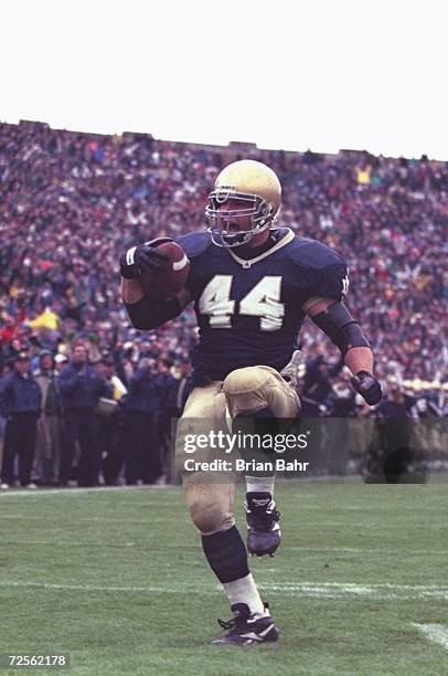 Fullback Marc Edwards of the Notre Dame Fighting Irish celebrates as he enters the end zone, scoring a touchdown, during the Fighting Irish's 38-10...