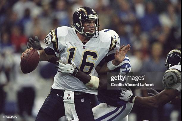 Quarterback Ryan Leaf of the San Diego Chargers is sacked from behind by Bertran Berry of the Indianapolis Colts during a game at the RCA Dome in...