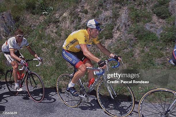 Lance Armstrong of the USA in the Yellow Jersey and riding for the US Postal team is shadowed by Jan Ullrich of Germany during Stage 14 from Tarbes...