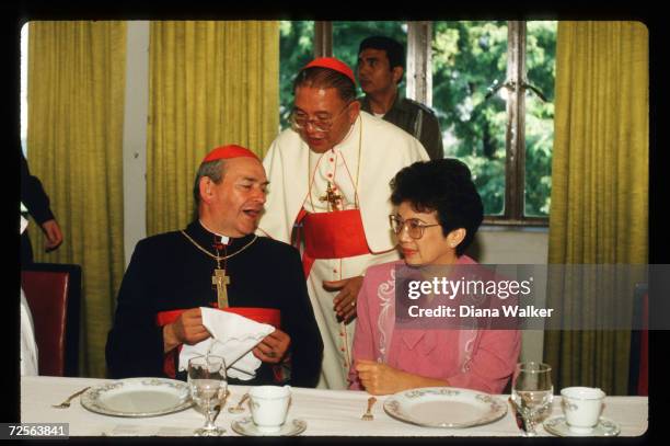 Corazon Aquino dines with Cardinal Thomas O''Fiach and Cardinal Sin December 8, 1986 in Manila, Philippines. Widow of assassinated Filipino senator...