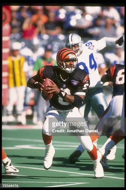 Quarterback Jeff Blake of the Cincinnati Bengals looks to pass the ball during a game against the Dallas Cowboys at Riverfront Stadium in Cincinnati,...