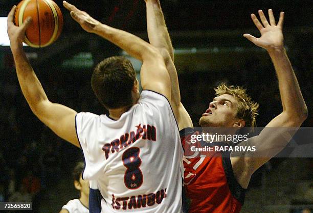 Tau Ceramica's Brazilian Tiago Splitter fights for the ball with Efes Pilsen's Nikola Prkacin during their Euroleague group A basketball match at the...