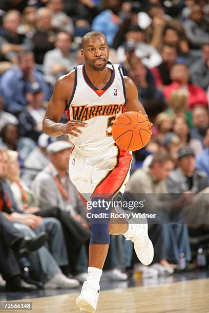 Baron Davis of the Golden State Warriors drives against the New Orleans/Oklahoma City Hornets during the game at the Oracle on November 9, 2006 in...