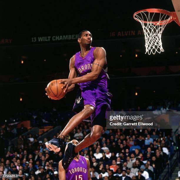 Tracy McGrady of the Toronto Raptors soars for a dunk during the 2000 NBA Slam Dunk Contest at The Arena in Oakland on February 12, 2000 in Oakland,...