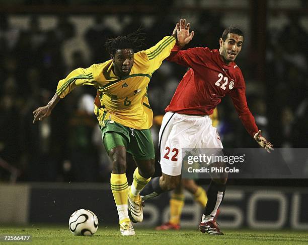 Macbeth Sibaya of South Africa gets tackled by Mohamed Alou Treka of Egypt during a International Friendly match between South Africa and Egypt for...