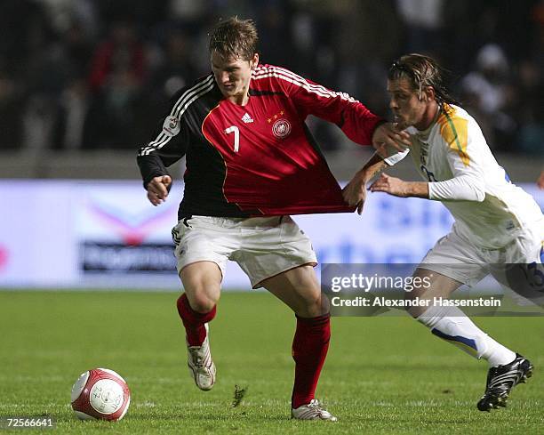 Bastian Schweinsteiger of Germany challenge for the ball with Simos Krassas of Cyprus during the Euro2008 qualifying match between Cyprus and Germany...