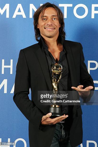 French DJ Bob Sinclar, poses for a picture backstage in the awards room with the World's Best DJ Award during the 2006 World Music Awards at Earls...