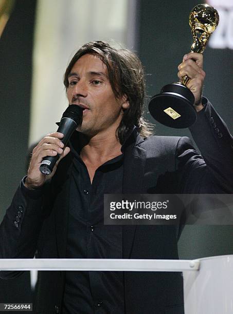 French DJ Bob Sinclar, , receives the World's Best DJ on stage during the 2006 World Music Awards at Earls Court on November 15, 2006 in London.