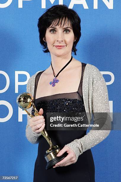 Irsih singer Enya poses for a picture backstage in the awards room with the Best-selling Irsih Artsist Award during the 2006 World Music Awards at...