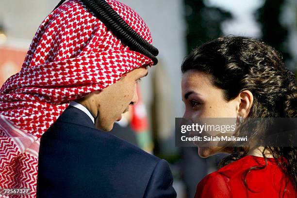 Jordan's Crown Prince Hamzeh bin al-Hussein and Princess Noor attend a ceremony in Amman May 25, 2004 to celebrate the 58th anniversary of...
