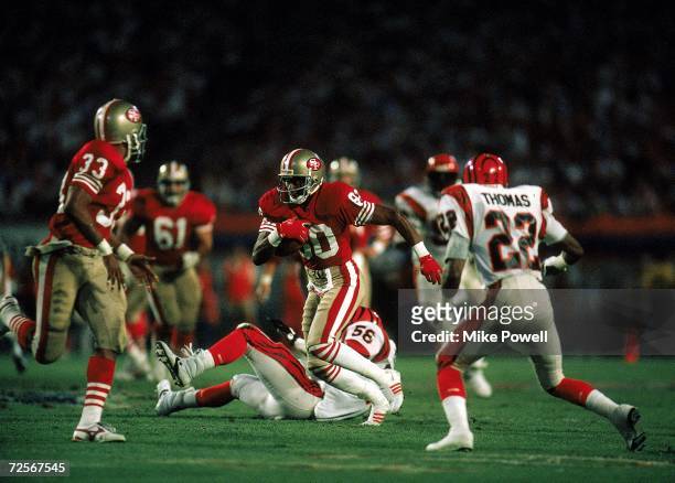 Jerry Rice of the San Francisco 49ers carries the ball during the Super Bowl XXIII against the Cincinnati Bengals, January 22, 1989. The 49ers...