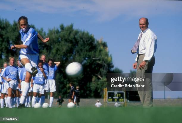 Assistant coach Bill Palladino of the North Carolina Tar Heels watches Charlotte Mitchell in action during a women''s soccer game against the...