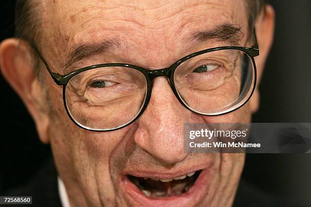 Federal Reserve Chairman Alan Greenspan laughs as he is introduced for a speech to the National Community Reinvestment Coalition March 18, 2005 in...