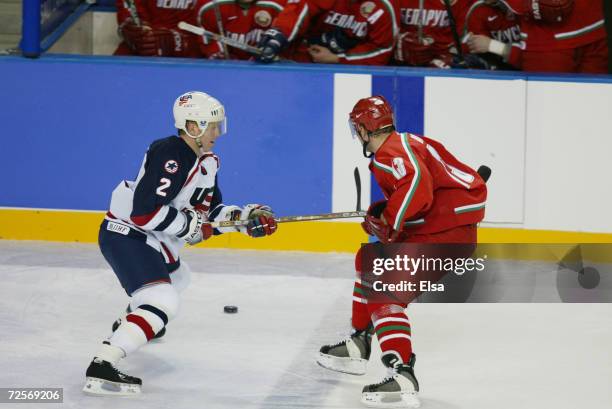 Brian Leetch of the USA slows up Andrei Kovalev of Belarus during the Salt Lake City Winter Olympic Games at the E Center in Salt Lake City, Utah....