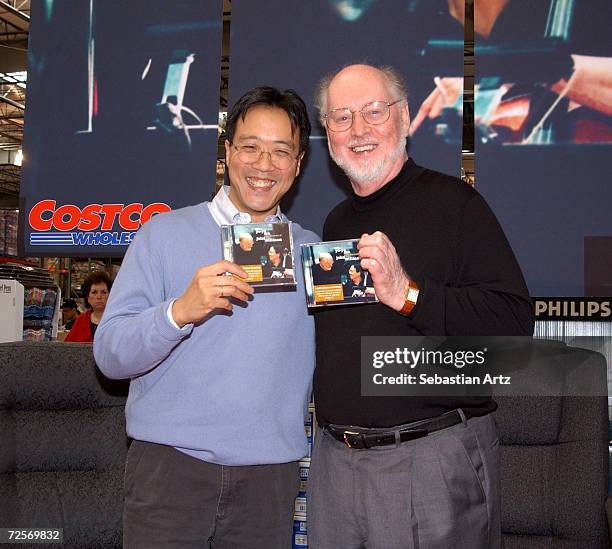 Cellist Yo-Yo Ma and music composer John Williams pose during a CD signing at Costco February 23, 2002 in Los Angeles, CA.