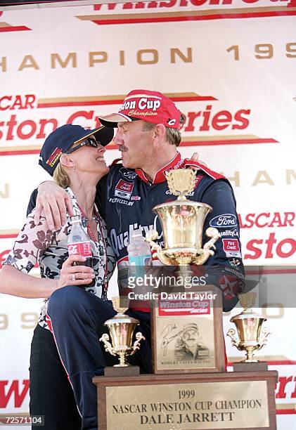 Dale Jarrett hugs his wife Kelly after winning the NASCAR Championship during the Pennzoil 400, part of the NASCAR Winston Cup Series at the...